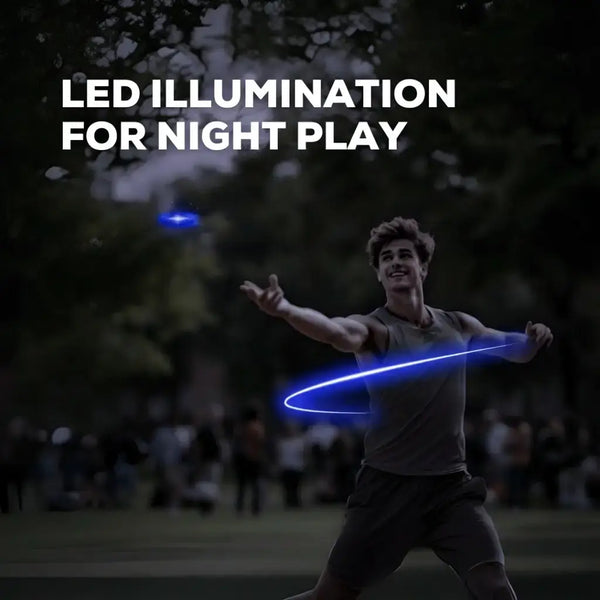 Person playing with a glowing LED disc in a park at night