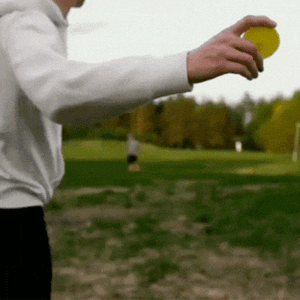 Teenage boy throwing a Gravity Disc mini flying disc outdoors, showcasing long-distance flight, outdoor play, sports toy action, and active family fun.